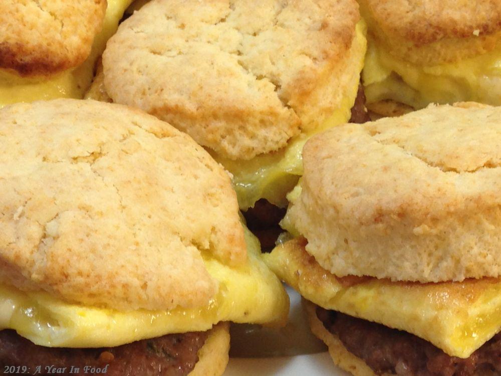 a platter of homemade sausage biscuts with egg and cheese