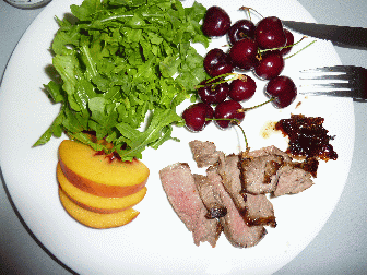 nice plate, looks like a small portion, fresh peaches being the most notable, and fresh cherries, otherwise, just a sald and steak