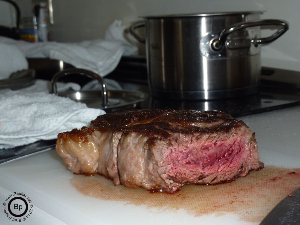 meat with broccoli pot in background