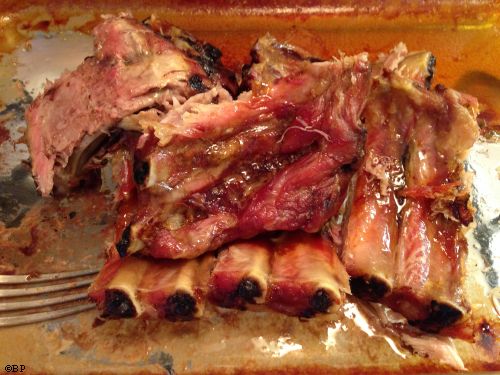 A rack of ribs, cut up, and in the dish in which they were cooked, for hours and hours and hours, so tender, so delicious, so ridiculously easy