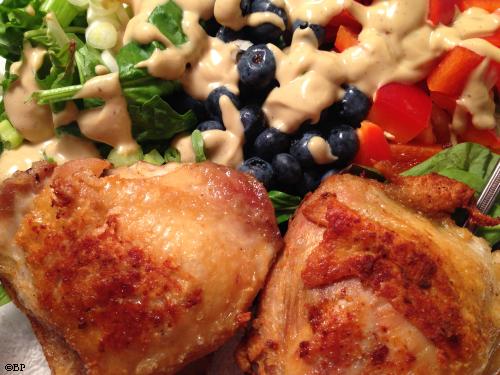 The very same fried chicken, nice and brown served with homemade dressing, salad, blueberries, and red pepper