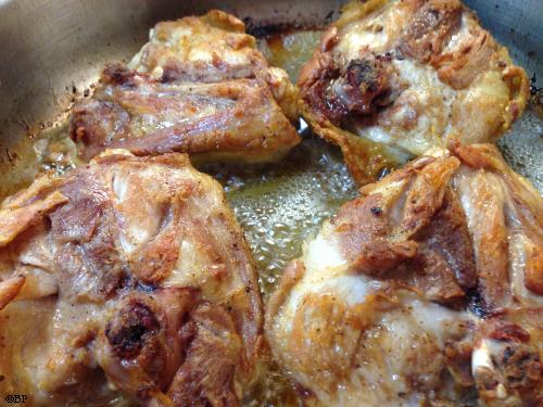 Chicken Thighs frying up in some nice golden delicious bacon fat