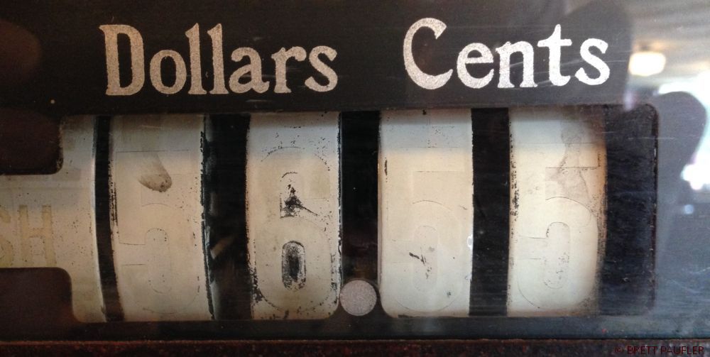 What Counts Close Up of an Old Cash Register Dials Dollars and Cents