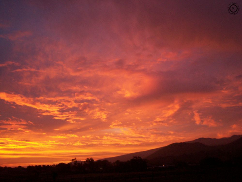 This is a sunset view of Mauna Loa on the Big Island of Hawaii as viewed fromt the backyard in years gone by