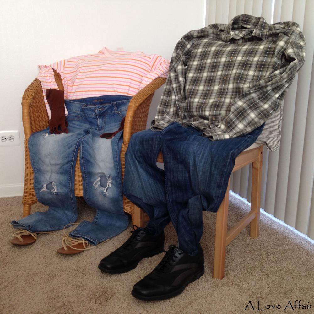 Laid out (or more accurately, sitting) on two chairs are two clothes outfits, mens and womens, matching, sort of, jeans, shirts, shoes and sandals.  They make a happy sort of Clothes Couple