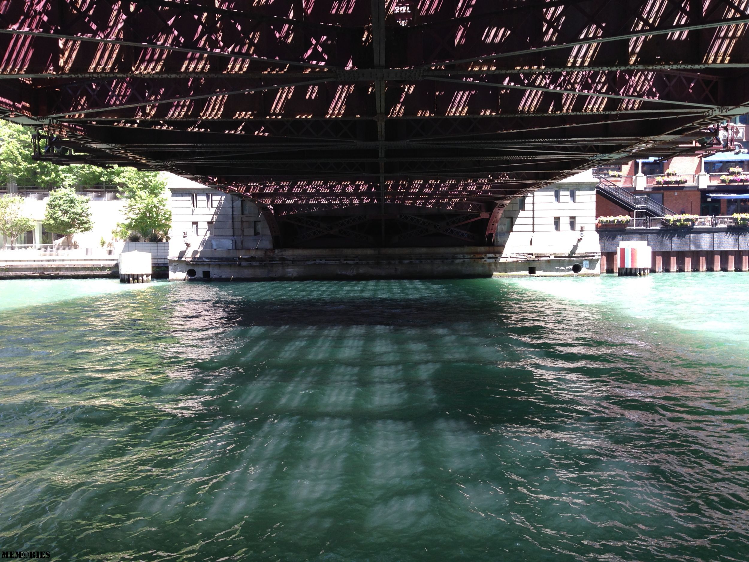 This is a bridge I like, I like it because on a sunny day, the light is broken up by the grating above, and diffused by the water below, creating all sorts of light dark visual effects, and then, cars roll over, breaking up the monotony while bringing with them a satisfying cacaphony of sound