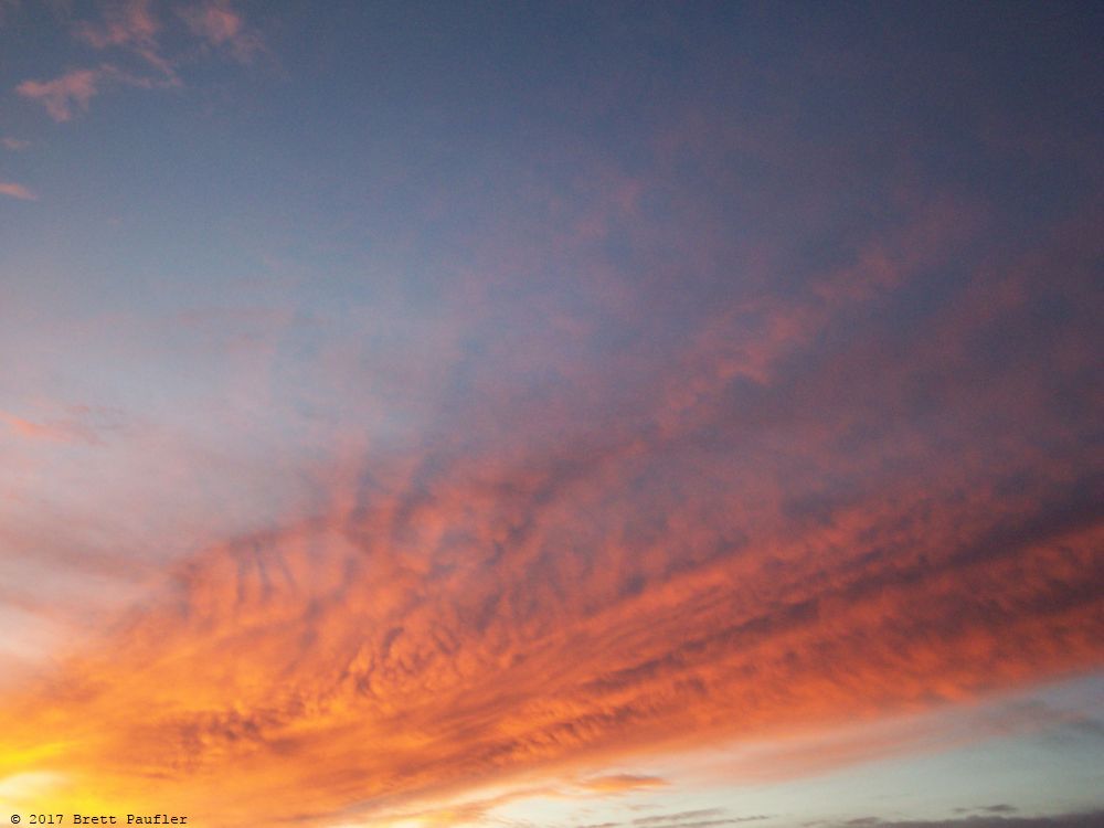 Cool colors, wonderful sunset, likely not that great, but a sunset, humans are funny folks, sunsets, we have been viewing them for a zillion years, and still find them pretty, now if you will excuse me, time to check my feed, wonder if anyone new has sent me a link