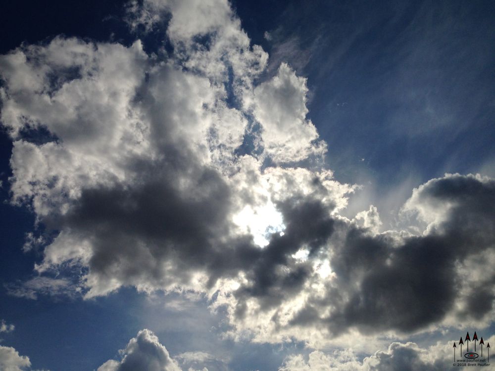 These are those nice fluffy clouds on an otherwise sunny day, very nice, the sun trying hard to burn through, a soothing sort of image to me