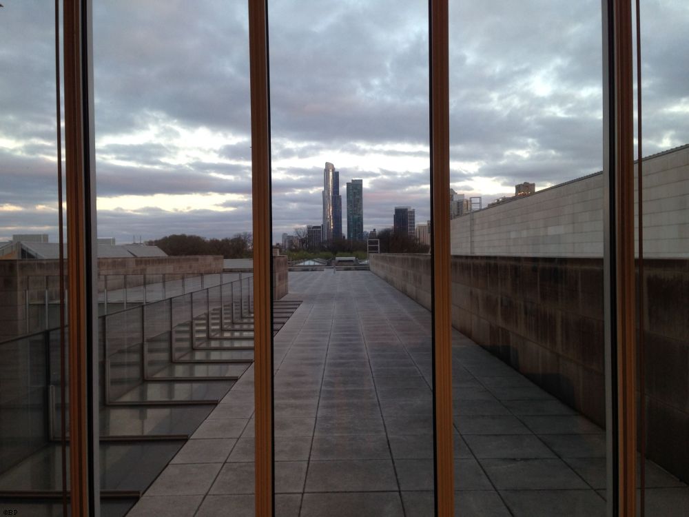 A pair of skyscrapers in the distance, looking out a window, a nice urban landscape picture, bars from the window casting vertical lines down the image