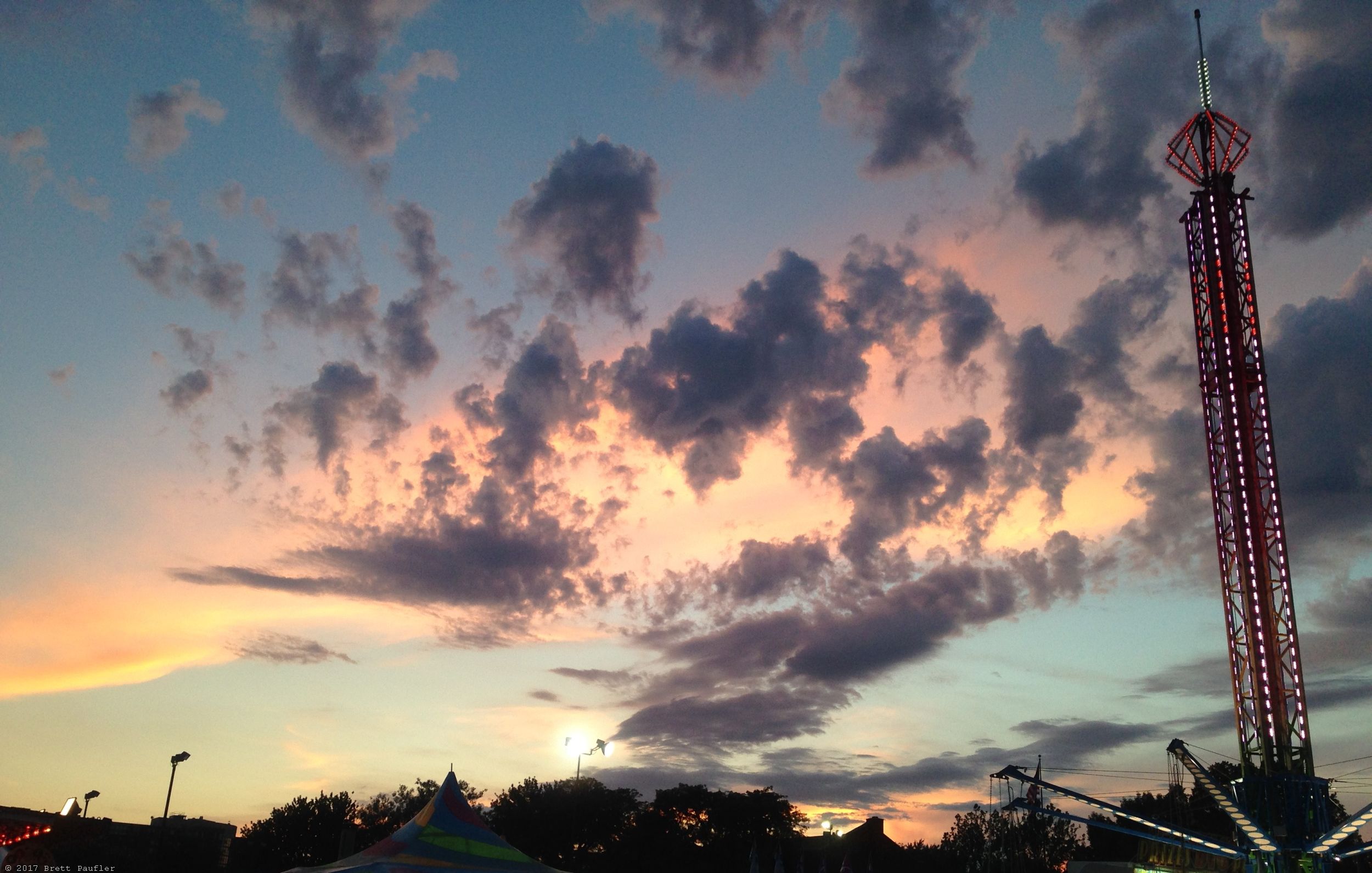 I was able to accompany two youngsters to the carnival and that made all the difference, a good excuse to watch them go on rides and snap pictures endlessly, of which almost none came out, not that that stops me, even when I took this shot, I knew I would be adding it to the sunset series, or that is to say, that is why I took this particular shot
