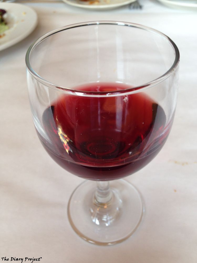 Wine, it is what is for lunch, and or, I had a few sips, it was wine, red glass, I like the reflection of the floor tile in the left of the glass, which is why I chose this image over several other that did not include the reflection