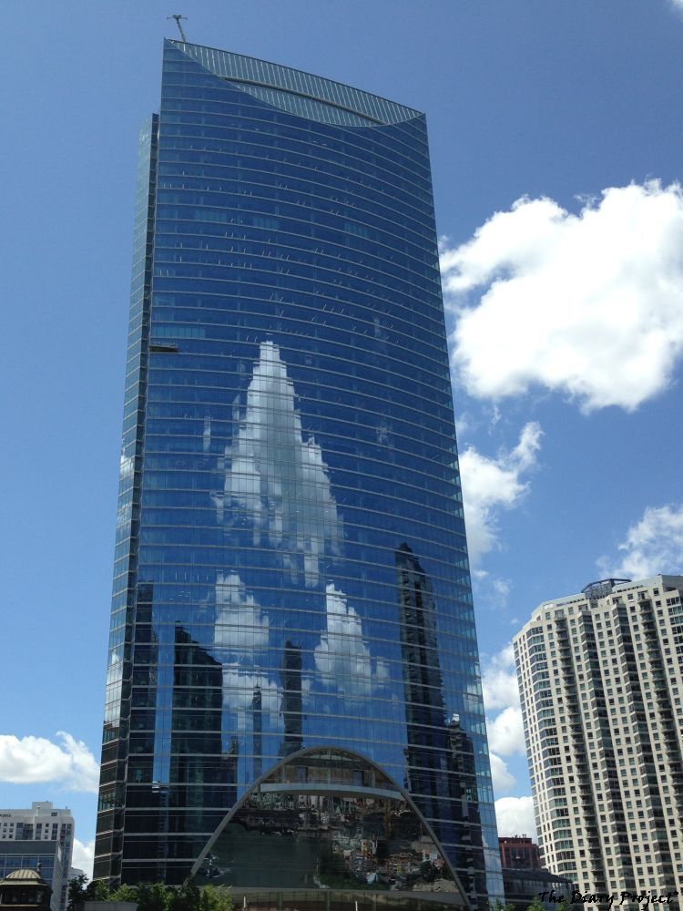 The windows of a skyscraper create a digitial reflection of the clouds in the sky, once again, something I personally find delightful, quite delightful