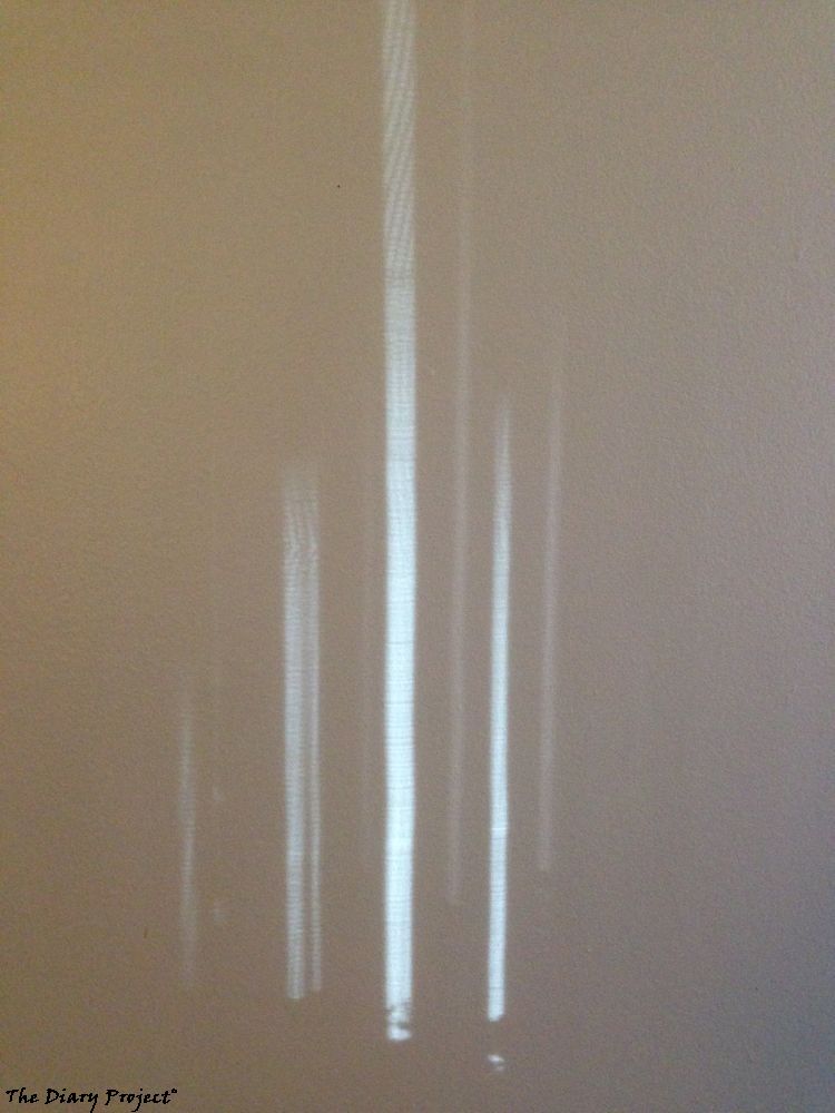 Window slats vertical bars of light, or cool stuff I saw on the wall, that really cannot be captured in film, because most of the cool part of this image has to do with motion, and the way the light shimmered in my brain