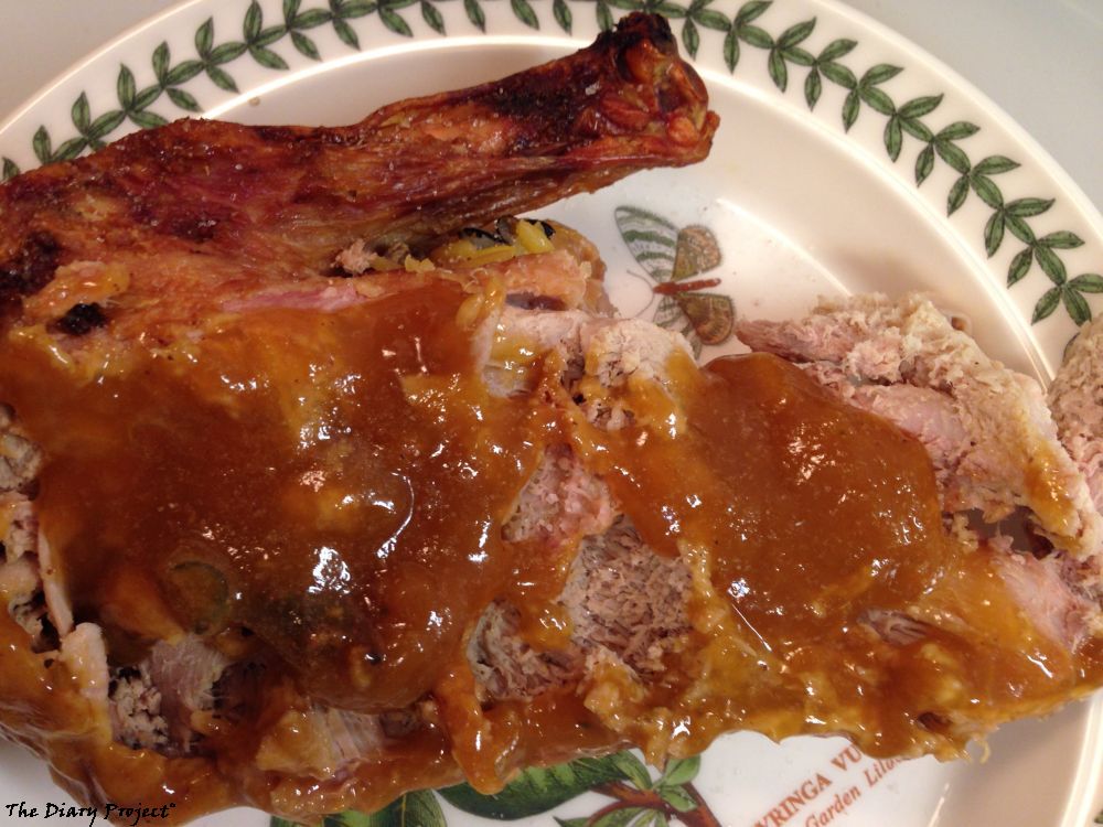 Half of a Half of Duck is shown, almost all of that half of a half was leftovers and it lasted me for two scrumptious meals, duck, and orange sauce, on a semi-fancy plate, or really, not a fancy plate at all, as much as it would like to be