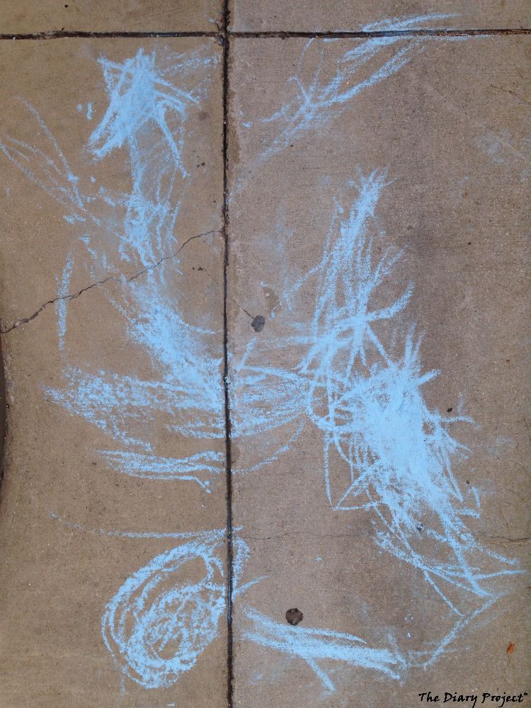 blue chalk on concrete walk, looks like a self portrait to me... or should that be, of me