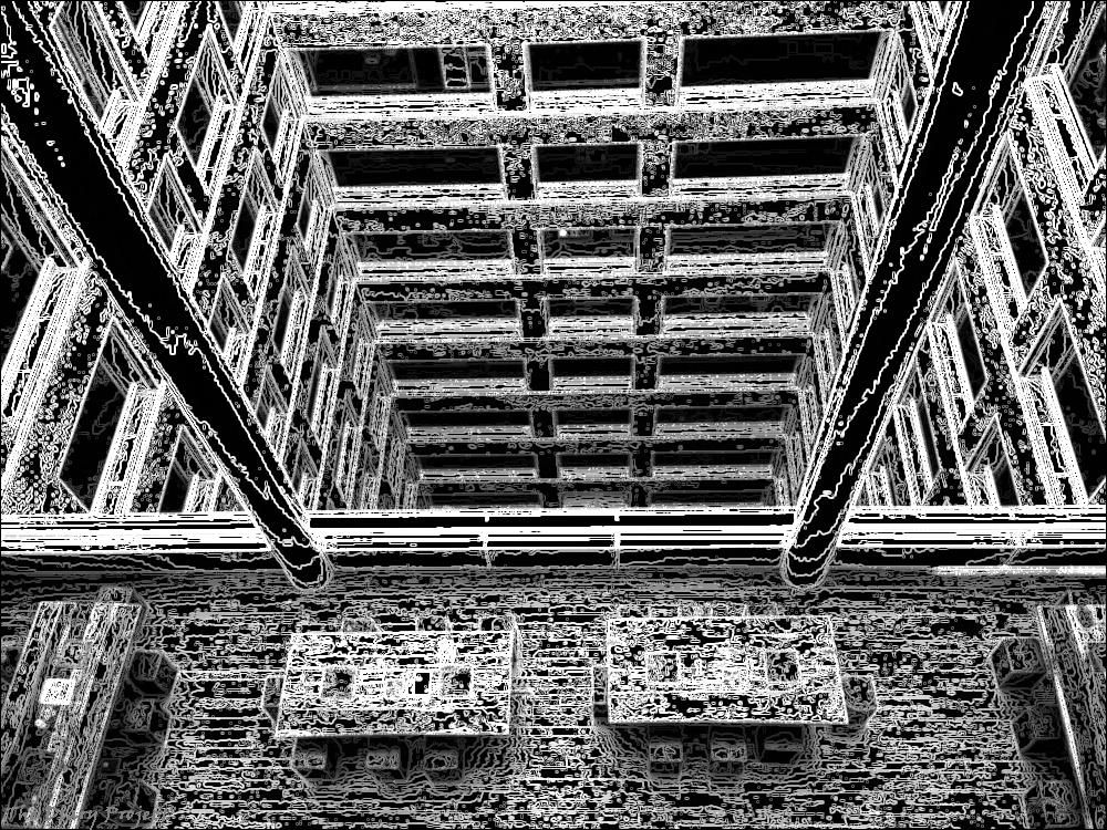 an image of a balcony, looking down to the floor below, desks beneath, hallways and offices across, all put through a filter making it hard to notice any details, maybe even what the picture is about... vertigo