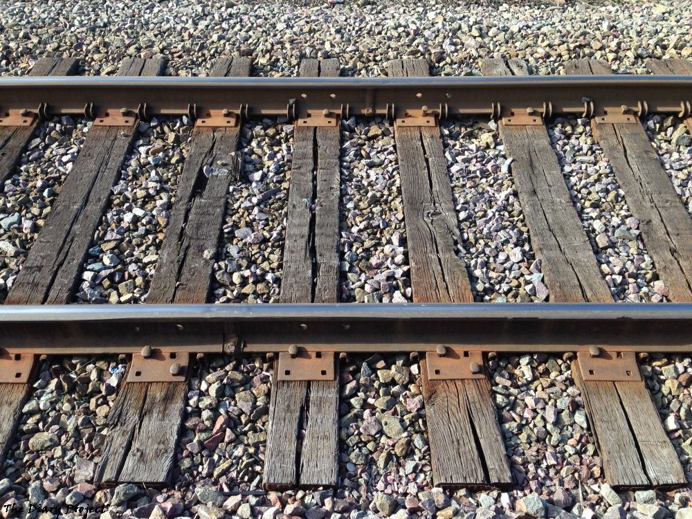 Railroad tracks, nothing much beyond that, I must have posted a few dozen, half dozen, at least two or three other images very similiar to this one on the site, I find them soothing, close up of railroad tracks, that is what it is