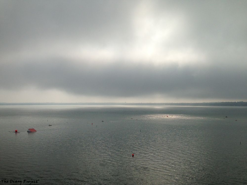 The bouys outline the race course for an Iron Man style swim a mile plus or go around twice for two miles, I like the way the sun is just poking through the morning overcase sky, look where it hits the water, its an empty picture, start of a day, full of possibilities
