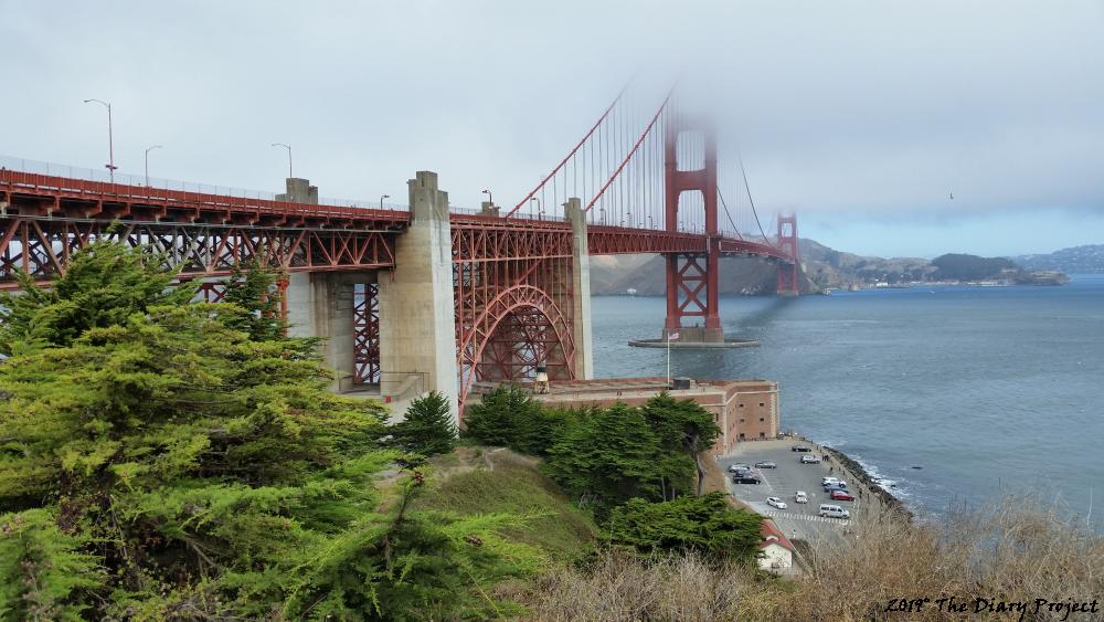 I give you The Golden Gate Bridge, it is now yours, or at least, this view of it is yours, back a little, from the tourist center, the approach is in view, as is Fort Pointless, below, with the fog on such a sunny day, I think it is a pleasing shot