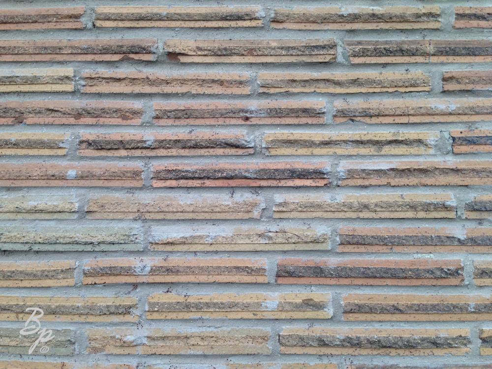 A Boring Picture for boring times, that is the logic, anyhow, thin bricks, lined to make a wall, they are super wide bricks, maybe eight times as wide as high, and the layers going up are pretty even, mortar being a third the thickness of the brick, and the brick being divided into thirds, smooth, rough, smooth, so it very much is like four layers, soother, way more words than such an image deserves, but very fitting for these times