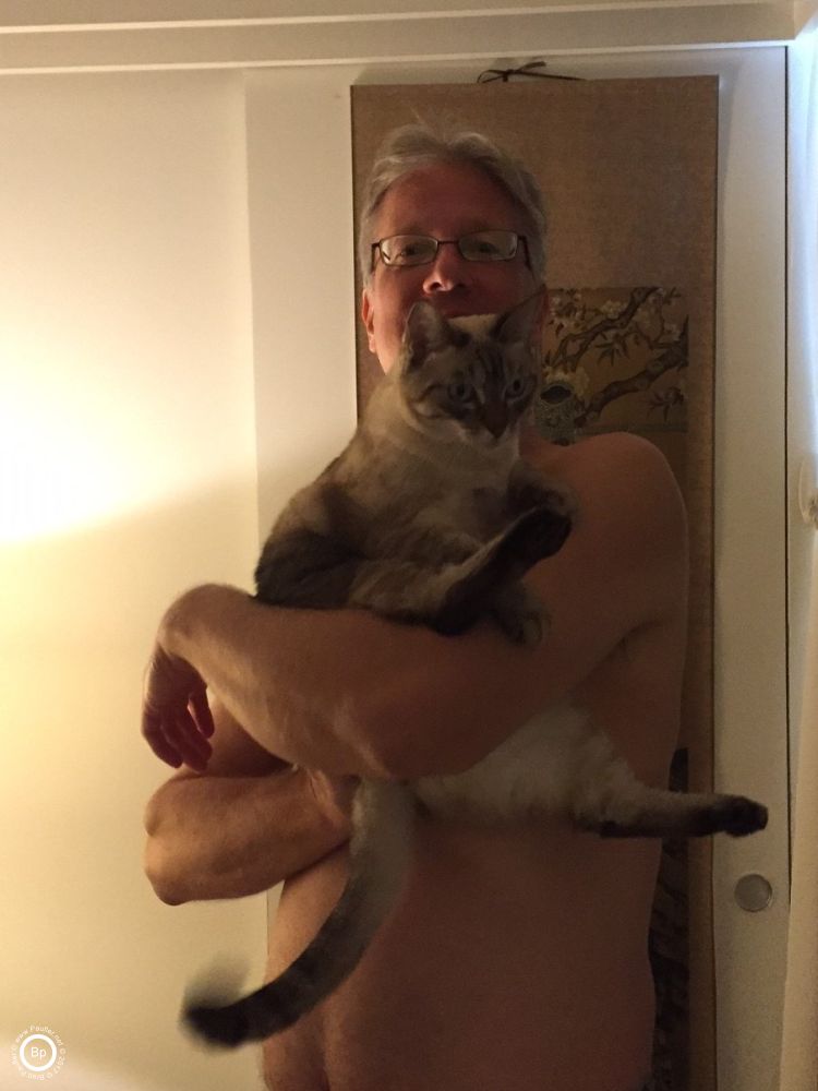 And then, I was not, here are four pictures, more or less the same, showing me holding her, her likely squirming and trying to get away, but even though I am shirtless, not overly concerned about her claws