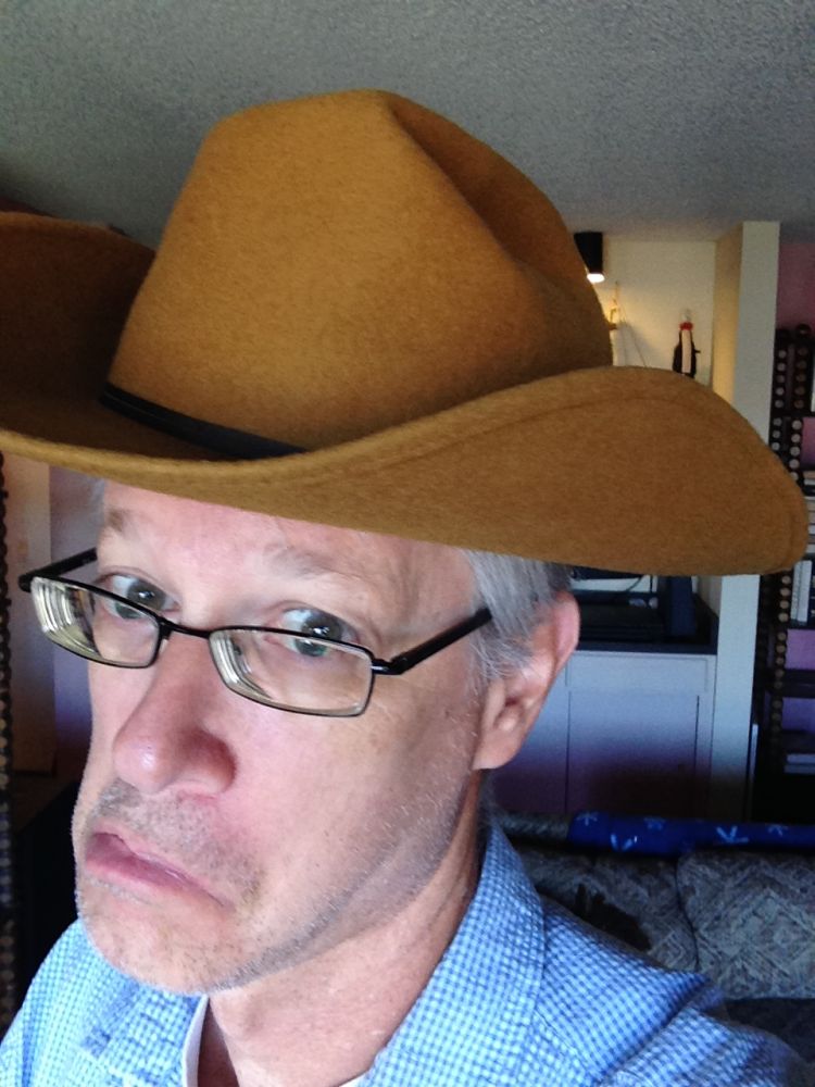 This is me mugging it in my fathers cowboy hat, likely he bought it on a trip to the Rockies, that sounds about right, I would have been six or so, who knows if it was a good time, lots of hours in a car, that would have meant, three and four hours a day with driving as a main event for two weeks on end, hard to imagine it was not filled with stress, I look back on that, and the first thing that comes to mind is the danger of road travel, so many hours in a car, how many families bit it, what a weird way to enjoy life, not that getting away was not fun, but the whole travelling thousands of miles, odd thing, I like mugging it, I am far more comfortable with it as an adult, judging by the images on the site, at some level, my father was OK with it too