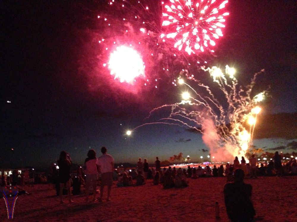 nice red hue from the explosion overhead, illuminating everyone on the beach