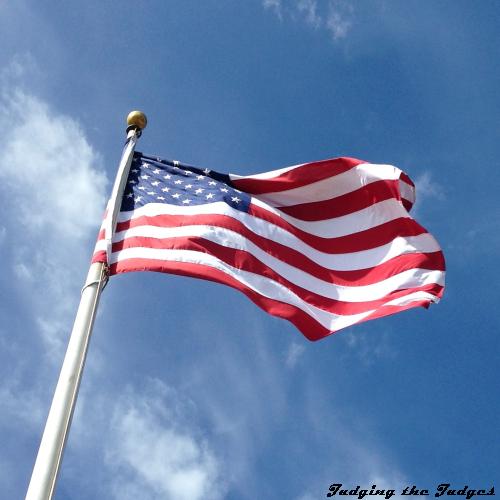 A United States of America flag fluttering in the wind, three time series images